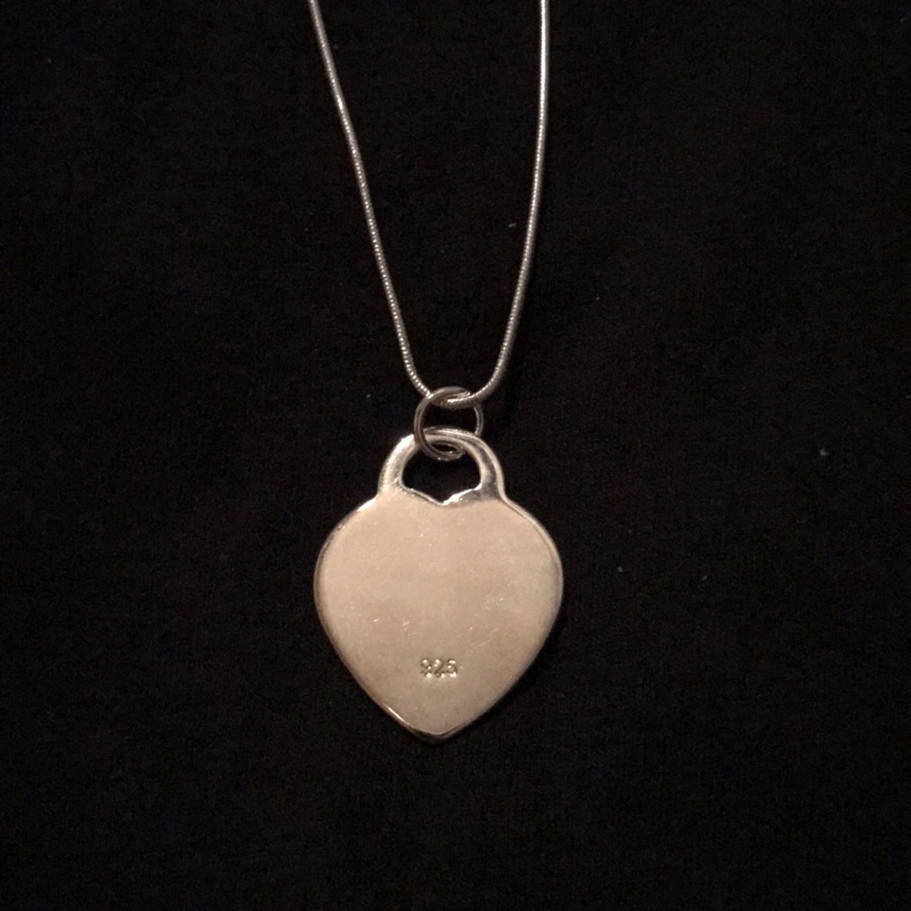 New. 925 silver 24” necklace with heart charm.